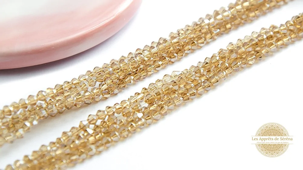 Perles toupies à facettes 3x3.5mm gold